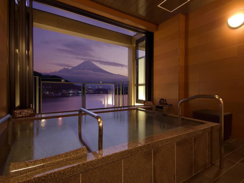 Panoramic balcony view of Lake Kawaguchi and Mount Fuji from a private suite at The Kukuna